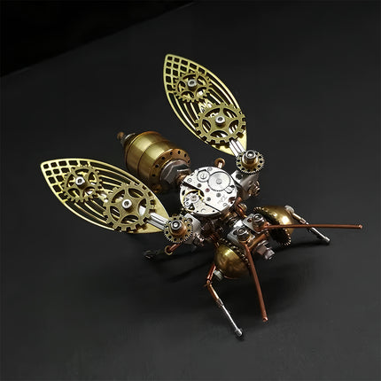 Close-up of Tablefunny steampunk mechanical bee 3D metal puzzle with intricate brass-colored gear wings, silver clockwork mechanism, and copper antennae on a black background.