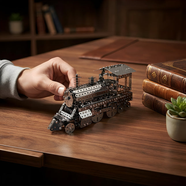 Intricate vintage metallic steam train puzzle model serving as a classic desktop ornament in a cozy study environment.