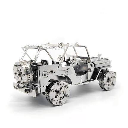Rear-right three-quarter view of a silver willys jeep diy metal model kit, showing the detailed spare tire, side tool engravings, and metal roof chains on a crisp white background.