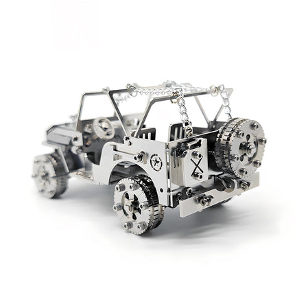Rear-left three-quarter view of a silver willys jeep metal puzzle, highlighting the mechanical spare tire, miniature fuel tank, and star military insignia on a white background.