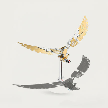 Table Funny 3D Puzzle Metal Kits Fold-Wing Machine Artwork - A stunning kinetic creation for DIY enthusiasts, industrial/mechanical design lovers, and decor admirers, this piece from Table Funny is an elaborate fold-wing machine (with motion function) assembled from 3D puzzle metal kits. It features a gold-and-silver metallic structure, articulated foldable wing segments (with gear details), a motorized core (for wing movement), and a clear stand base